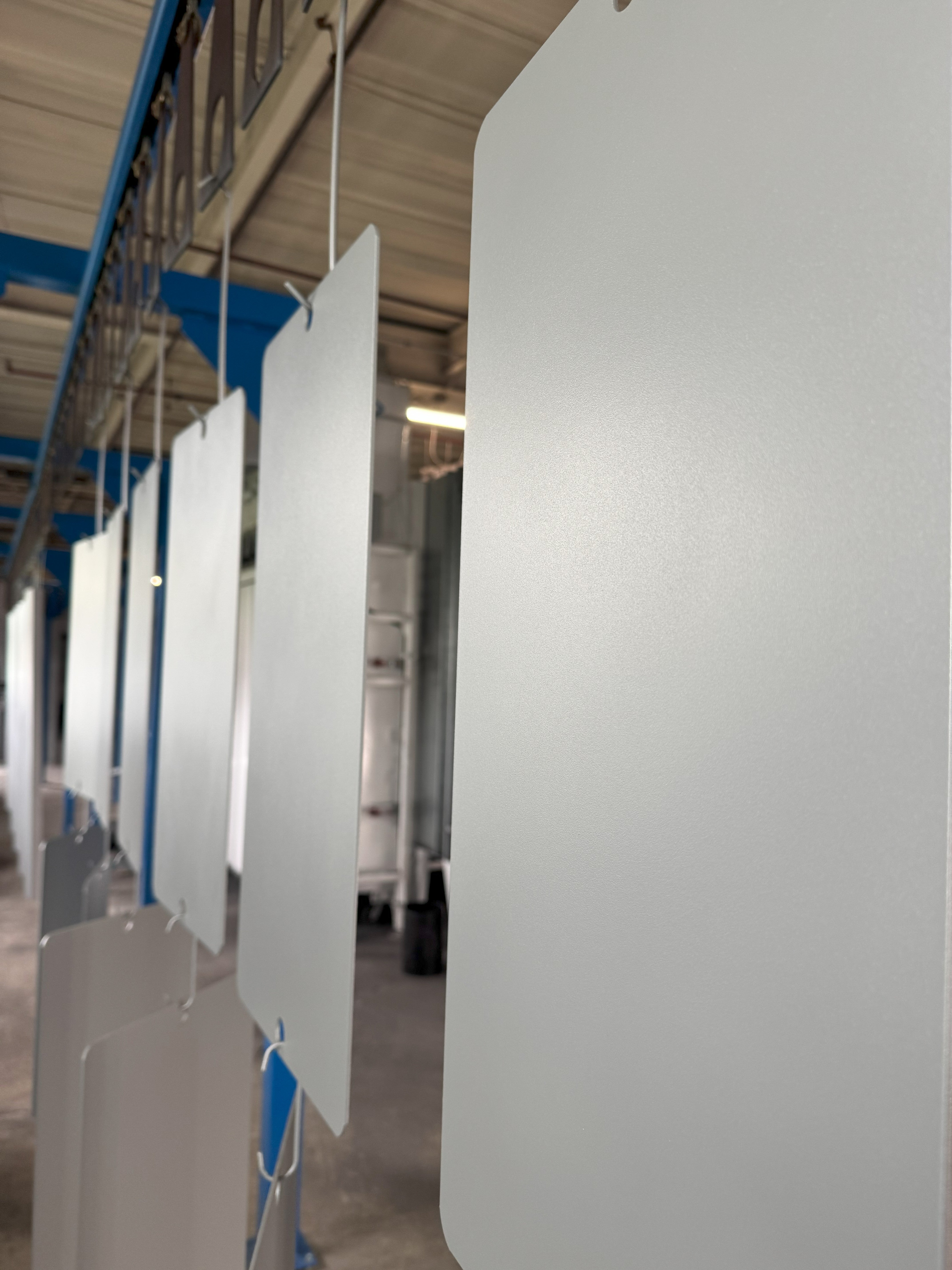NJ Powder coating line with silver texture powder coating on top of 12x24 Steel bases